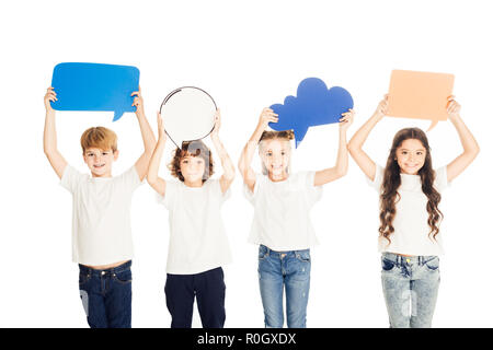adorable children holding paper speech bubbles above heads isolated on white Stock Photo