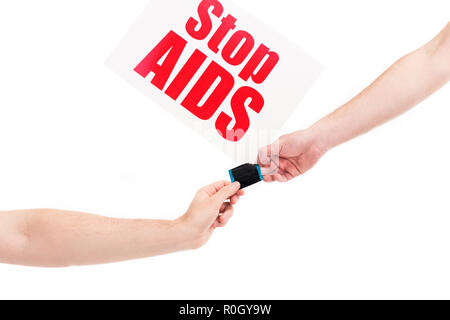 cropped image of girlfriend and boyfriend holding condom, card with stop aids text isolated on white Stock Photo