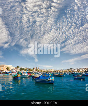 Marxaslokk harbor with traditional maltese eyed boats - luzzu on the ...