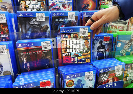 Store display filled with PlayStation 4 games for a home video game console  Stock Photo - Alamy