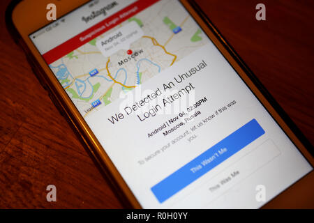 General view of someone holding a phone in London with an Instagram message about it being hacked from Moscow in Russia on the screen, London, UK. Stock Photo