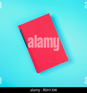 Red book on the green metal table Stock Photo