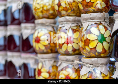 Multicolored fruit and berry jam in glass jars. Stock Photo