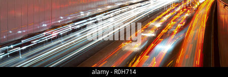 Light lines of car headlights. Stock Photo