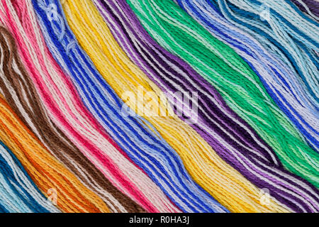 Long strands of colorful yarn in diagonal lines Stock Photo