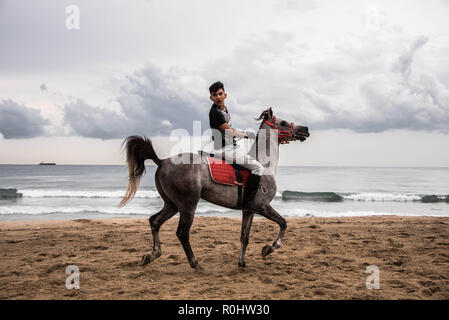 November 4, 2018 - Saida, Lebanon - A jockey seen on his horse before the horse race..Horse race at the Saida festival for speed, held on a public town beach, organised by a joint effort from the municipality of Sidon and the Ride-Along Club. (Credit Image: © Elizabeth Fitt/SOPA Images via ZUMA Wire) Stock Photo