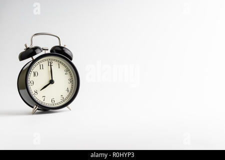 Alarm clock on white background with selective focus Stock Photo
