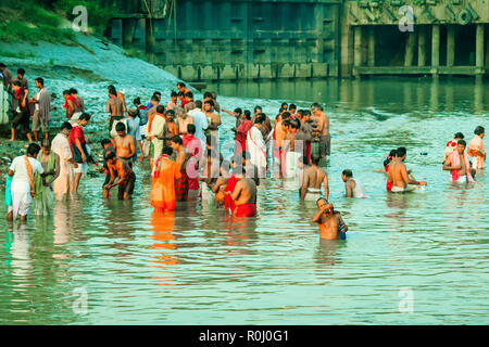 HARIDWAR, INDIA - JANUARY 14, 2016: Devotees taking holy dip at Har Ki Pauri on river Ganga on the first bath of Ardh Kumbh fair. People took a dip in Stock Photo