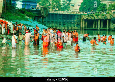 HARIDWAR, INDIA - JANUARY 14, 2016: Devotees taking holy dip at Har Ki Pauri on river Ganga on the first bath of Ardh Kumbh fair. People took a dip in Stock Photo