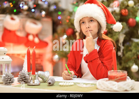 Portrait of a cute little girl writing letter Stock Photo