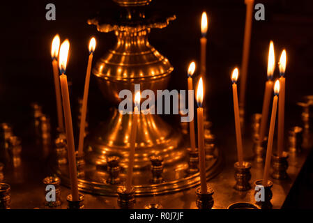 Close up candles burning in a church Stock Photo