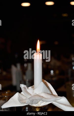 The flame of a candle with black background Stock Photo