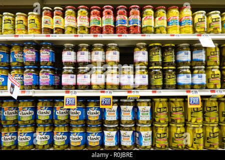 Shelves full of pickles and peppers for sale on display in a small grocery store in Speculator, NY USA Stock Photo