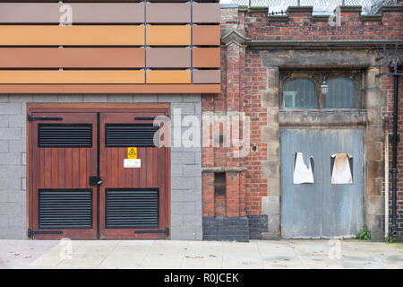 brown, orange, yellow and red cladding panels surrounding the indoor car park beneath the Tesco Extra store Trinity Square Gateshead, Tyne and Wear UK Stock Photo