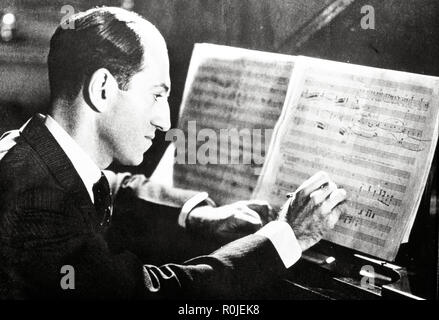 George Geshwin composing at the piano, 1936. Stock Photo