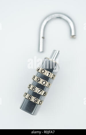 Broken padlock cut out isolated on white background Stock Photo