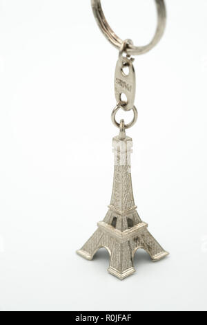 Miniature Eiffel Tower metallic key-chain Paris souvenir cut out isolated on white background Stock Photo