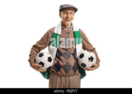 Senior soccer fan holding two soccer balls isolated on white background Stock Photo
