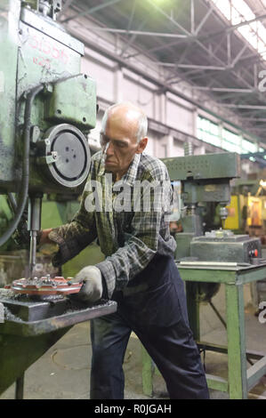 Tyumen, Russia - September 7, 2010: JSC Tyumenskie Motorostroiteli Plant on production and repair of aviation engines. Milling-machine operator works  Stock Photo