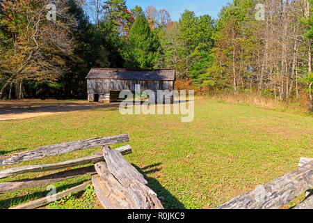 Rustic double crib barn and split rail fence, Cades Cove Historic Area, Smoky Mountains National Park Stock Photo