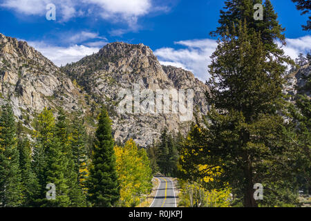 Driving through the Sierra mountains towards Sonora pass on a sunny autumn day, California Stock Photo