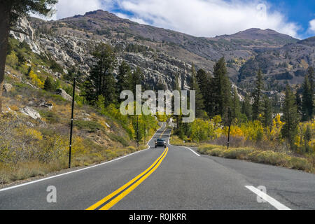 Driving through the Sierra mountains towards Sonora pass on a sunny autumn day, California Stock Photo