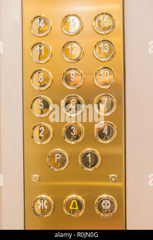 Gilded buttons for selecting floors in the elevator Stock Photo