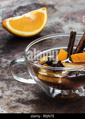 A hot mulled wine decorated with orange pieces and cinnamon sticks. Germany, Allgäu, August 03 Stock Photo