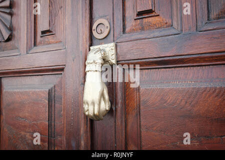 old knocking door knob on wooden door closeup Stock Photo