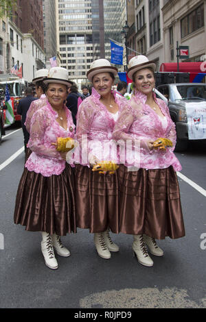 2018 Hispanic Day Parade on 5th Avenue in New York City. Traditionally dressed 'Cholita' folk dancers at the parade with Bolivian Bowler hats. Stock Photo