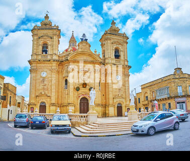 XAGHRA, MALTA - JUNE 15, 2018: The  Basilica of Nativity with the statues in front of the entrance and scenic carved decors on the walls, on June 15 i Stock Photo
