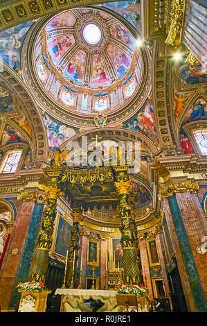 VICTORIA, MALTA - JUNE 15, 2018: The marble papal altar, covered with reliefs of angels and the ornate canopy, decorated with gilt carvings, St George Stock Photo