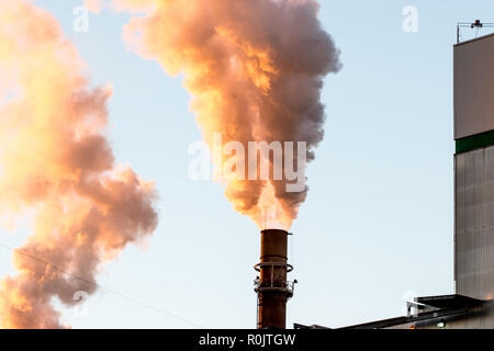 Toxic smoke from paper manufacturing plant emissions Stock Photo