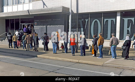 A diverse line of voters wait to cast their ballots for the 2018 Midterm Elections at the Cuyahoga County Board of Elections in Cleveland, Ohio, USA. Stock Photo