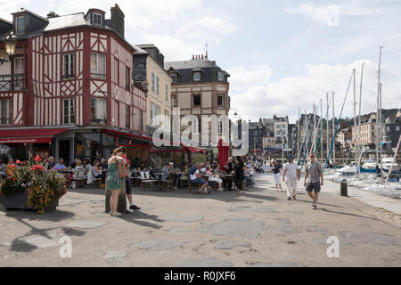 Crowded restaurants around the inner port, Honfleur Normandy, France Stock Photo