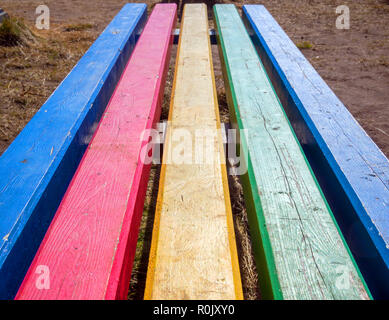 Street bench from multi-colored boards Stock Photo