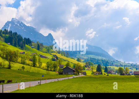 Countryside road in village, Alt Sankt Johann, Sankt Gallen, Switzerland Stock Photo