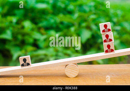 High demand for specialists, labor migration and employee poaching. Staff training Cubes with images of employees on the scales. A talented and qualif Stock Photo