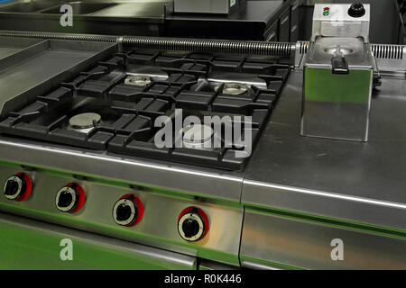 Professional kitchen stove with four gas burners Stock Photo