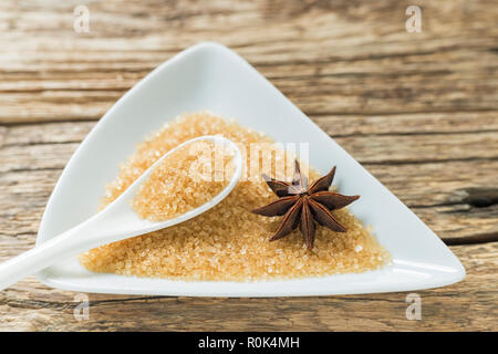 brown sugar in spoon and anise on the me.... Stock Photo