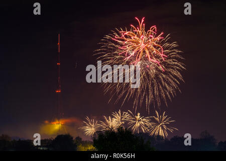 View of fireworks display, Crystal Palace park, and transmitting station (tv transmitter) on bonfire night, the 5th November, remembering Guy Fawkes Stock Photo