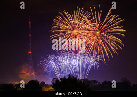 View of fireworks display, Crystal Palace park, and transmitting station (tv transmitter) on bonfire night, the 5th November, remembering Guy Fawkes Stock Photo
