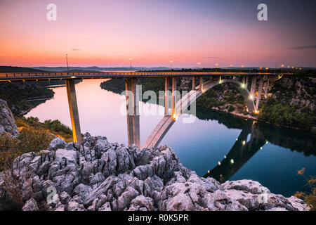 Sibenik bridge over river Krka illuminated at blue hour, near Skradin village in Croatia. Stock Photo