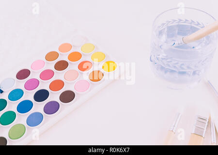 Artist's watercolor / watercolour paint set and brushes on a white background. Stock Photo