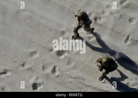 Airmen rush across Island Beach State Park, New Jersey. Stock Photo