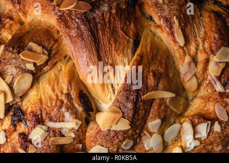 Freshly baked Easter bread with chocolate and almonds as background. Stock Photo