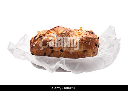 Easter bread with chocolate and almonds isolated on white background. Stock Photo