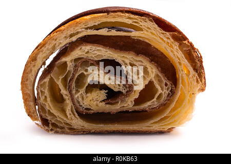 Slice of freshly baked french croissant with chocolate isolated on white background Stock Photo