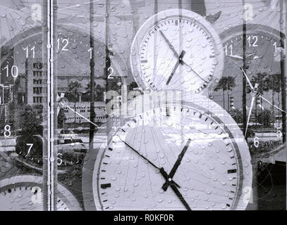 Large clocks reflecting in shop window illustrate the concept of time Stock Photo