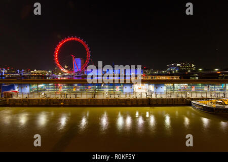 The BA London Eye and the River Thames looking east from the Victoria Embankment at night, London, England Stock Photo